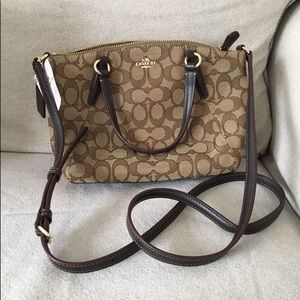 Brand new, never used Coach bag with tags.